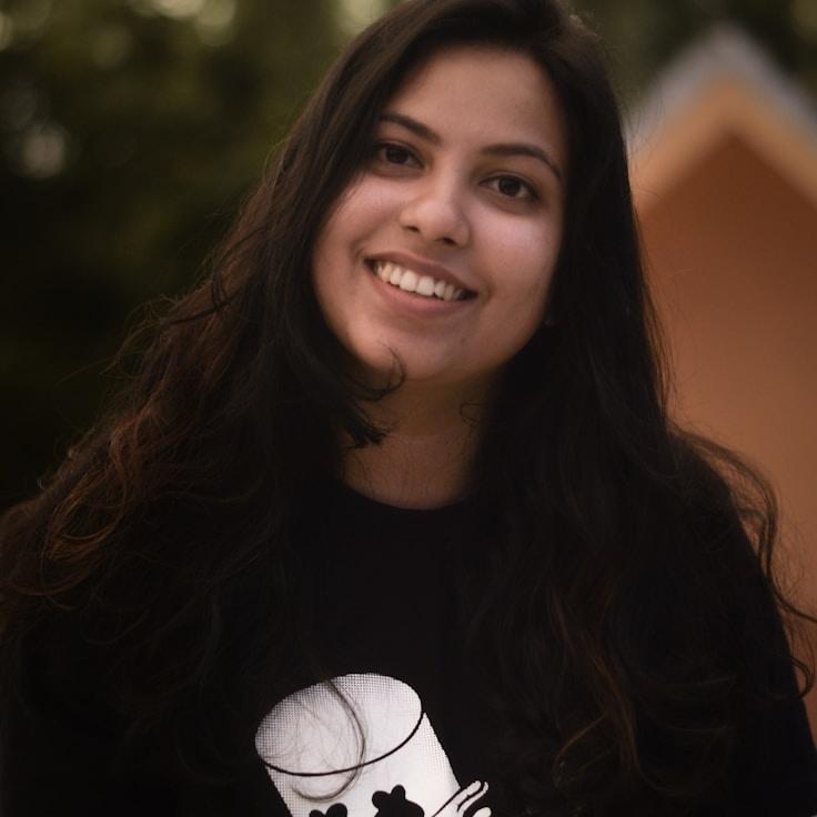 Anaya Shah, Lead Design Curator at FoundryVectorRiver, reviewing corporate floral arrangements